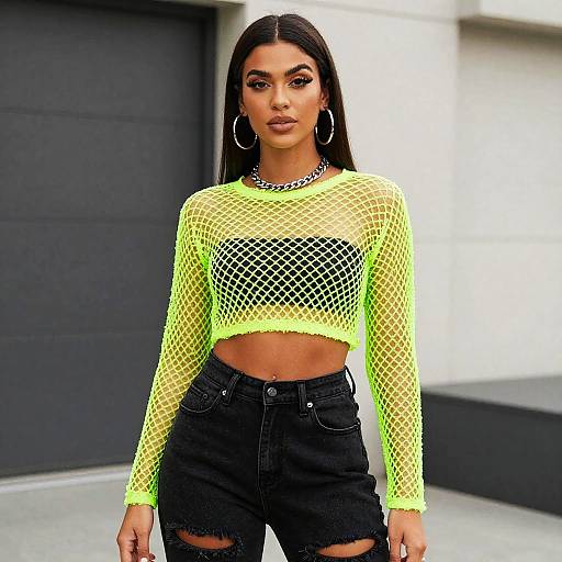 Trendy Woman in Neon Green Fishnet Crop Top and Black Distressed Shorts