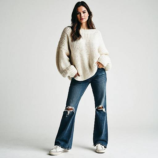 Young Woman in Oversized Sweater and Ripped Flared Jeans Casual Outfit