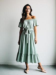 Bohemian Chic Woman in Pale Mint Green Off-the-Shoulder Midi Dress