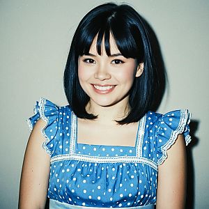 Young Woman in Blue Polka Dot Dress