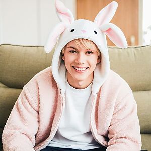 Young Man in Bunny Hat on Couch