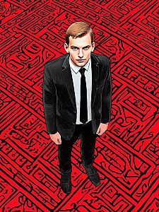 Man in Black Suit Against Red Abstract Background