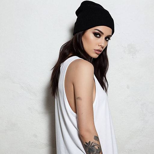 Stylish Woman in Black Beanie and White Tank Top with Tattoos
