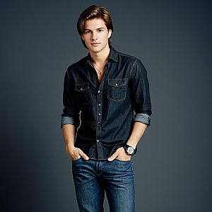 Portrait of Young Man in Dark Denim Shirt and Jeans