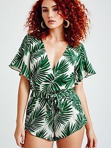 Red-Haired Woman Wearing Tropical Leaf Print Romper