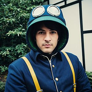 Man Wearing Navy Blue Coat with Yellow Suspenders and Goggled Hood Outdoor