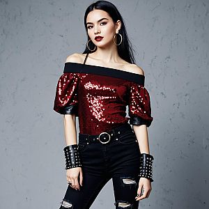 Fashionable Woman in Red Sequin Top and Black Ripped Jeans