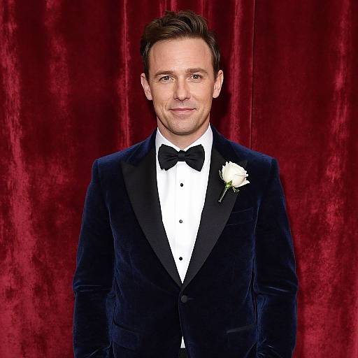 Man in Elegant Blue Velvet Tuxedo with White Rose Boutonniere