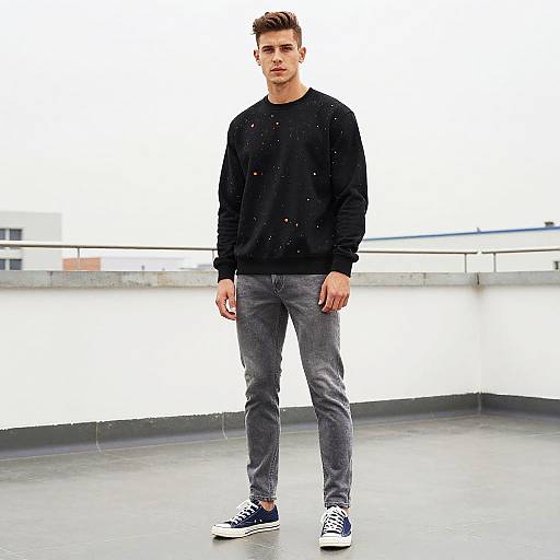 Lean Man Wearing Black Sweatshirt with Orange Splatters in Streetwear Outfit