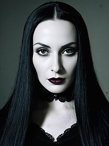 Woman in Morticia Addams Costume Close-Up Headshot with Pale Skin and Gothic Makeup