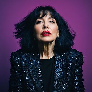Confident Woman in Sequined Jacket