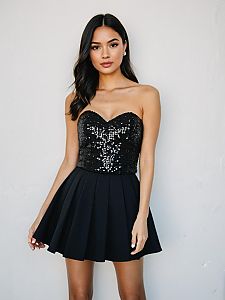 Woman in Contemporary Strapless Black Sequined Party Dress