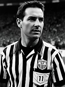 Black and White Vintage Portrait of Male Sports Referee in Striped Uniform