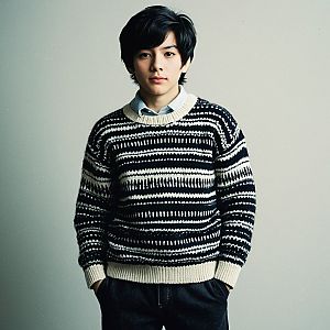 Confident Young Man in Cozy Knitted Sweater
