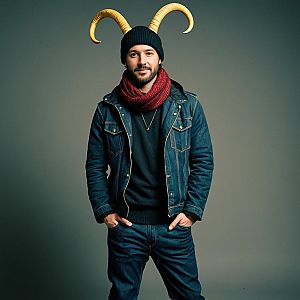 Man in Denim Jacket with Red Scarf and Beanie