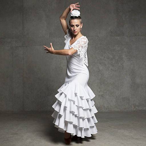 Flamenco Dancer in White Ruffled Dress Performing Traditional Dance