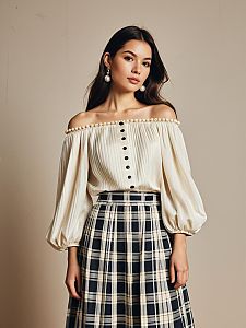 Elegant Woman Wearing Pearl-Embellished Off-Shoulder Blouse and Plaid Skirt