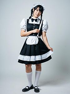 Young Woman in Classic French Maid Cosplay Outfit Full Body Studio Photo