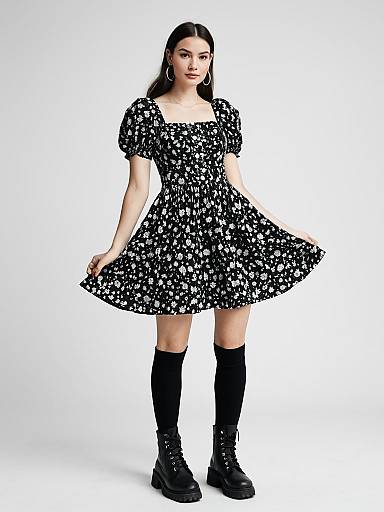 Woman Wearing Black and White Floral Short Flared Dress with Puff Sleeves