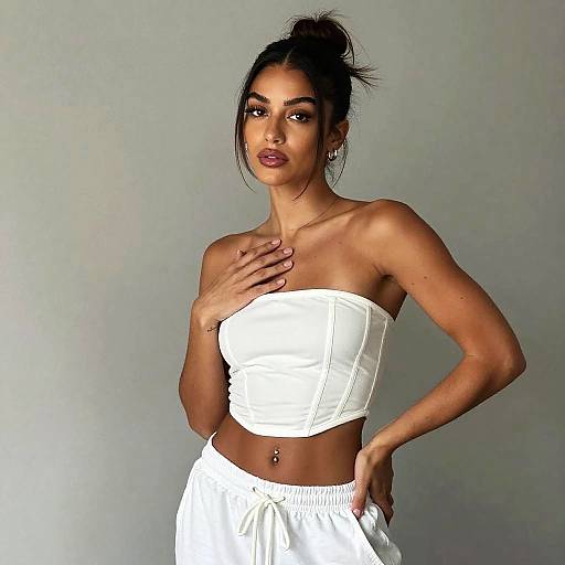 Confident Woman in White Corset Top and Casual Pants Fashion Portrait