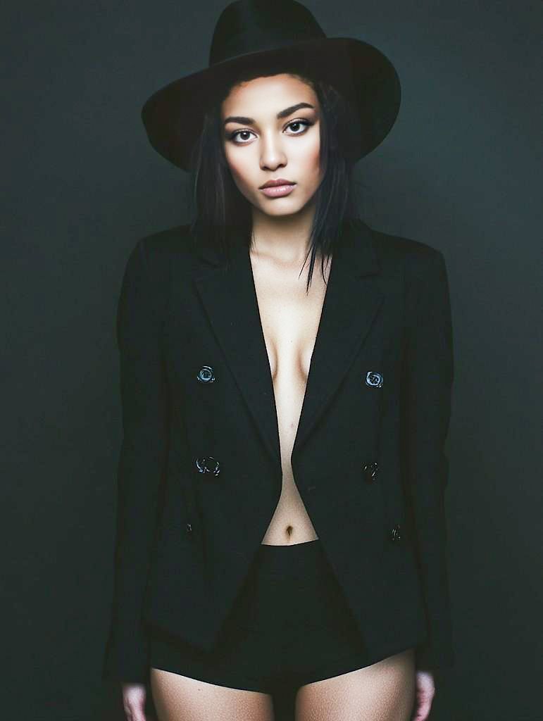 Woman in Black Blazer and Hat