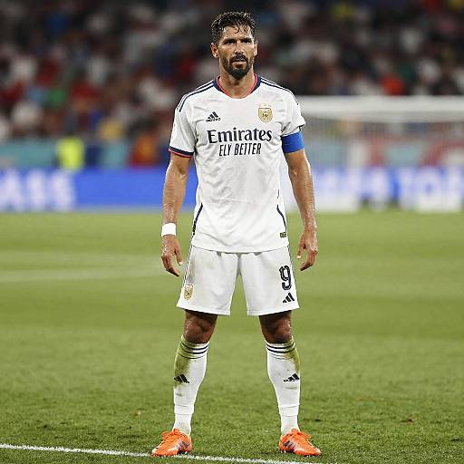 Famous Male Soccer Athlete in White Uniform Standing on Soccer Field