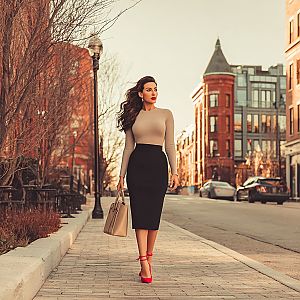 Fashionable Woman in Chic Outfit on City Sidewalk