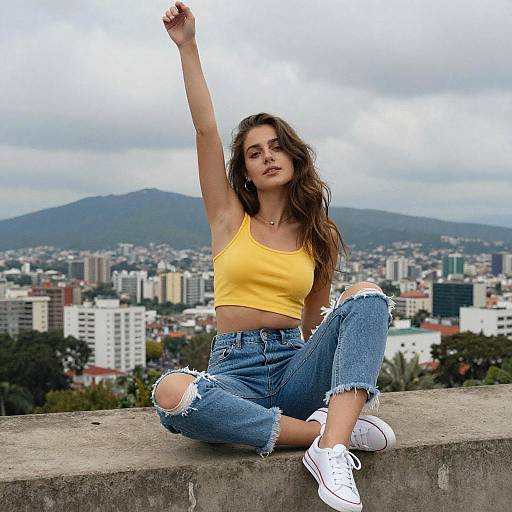 Confident Young Woman in Yellow Crop Top and Ripped Jeans Urban Cityscape