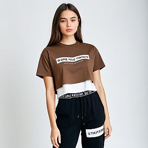 Young Woman in Trendy Brown Cropped T-Shirt and Black Pants Streetwear