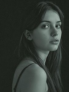 Realistic Portrait of Young Woman with Long Hair in Soft Lighting