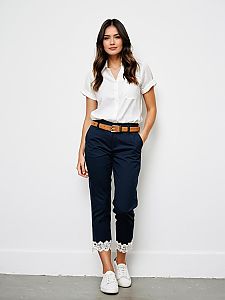 Woman in Casual White Shirt and Navy Cropped Pants with Lace Detail