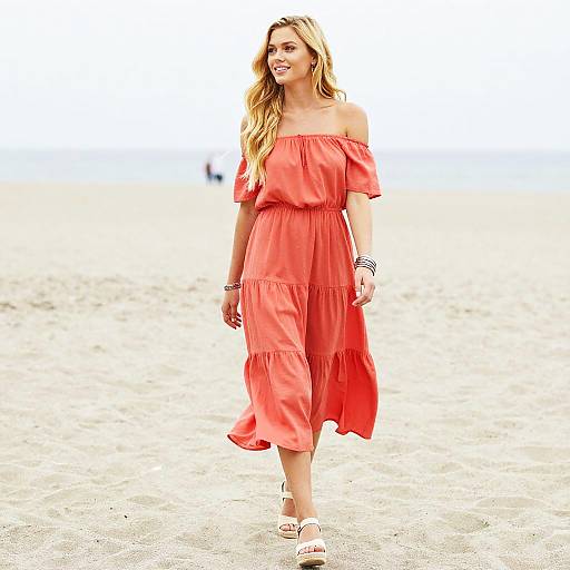 Woman in Coral Off-Shoulder Dress Walking on Beach