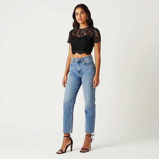 Young Woman Wearing Black Lace Crop Top and High-Waisted Blue Jeans Fashion Look