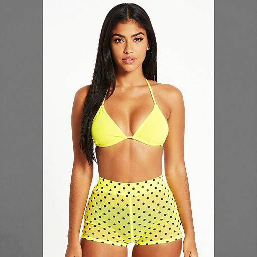 Confident Woman in Yellow Bikini Top and Polka Dot Shorts