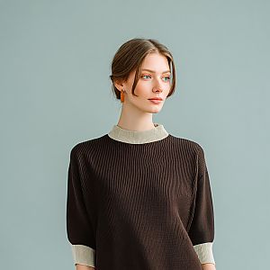 Thoughtful Young Woman in Brown Sweater
