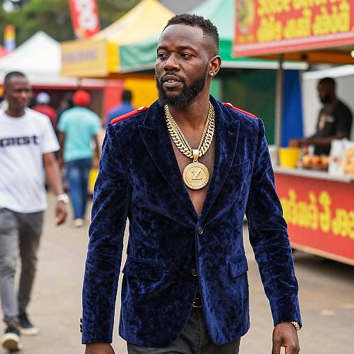 Man in Blue Velvet Blazer with Gold Chains Street Style