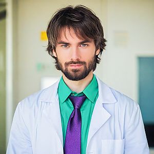 Confident Young Man in Lab Coat