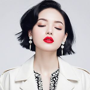 Stylish woman in white trench coat with bold lipstick