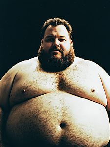 Photorealistic Editorial Portrait of Man in Fat Guy Costume Waist Up