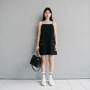 Woman in Black Slip Dress with Sneakers
