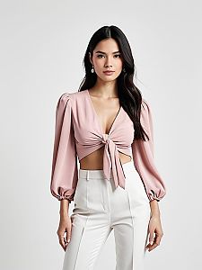 Contemporary Chic Woman Wearing Soft Pink Knot Blouse with Puff Sleeves and White High-Waisted Pants