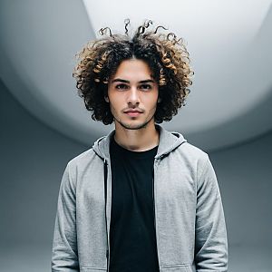 Confident Young Man in Modern Indoor Setting