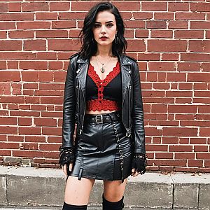 Confident Woman in Edgy Black Leather Against Brick Wall