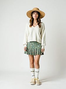 Boho Casual Woman in White V-Neck Sweater and Floral Skirt