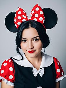 Professional Woman in Minnie Mouse Costume with Classic Red Bow and Polka Dots