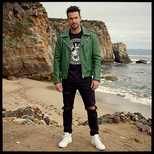 Man Wearing Green Leather Jacket and Ripped Jeans on Rocky Beach