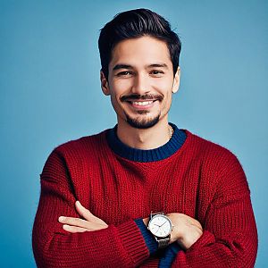 Confident Young Man in Red Sweater