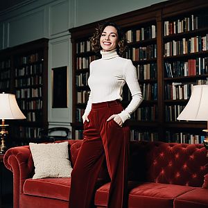 Confident Woman in Elegant Library